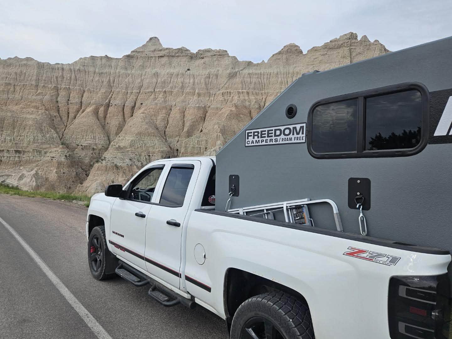 Freedom Camper mounted on a Chevy Silverado in the Badlands